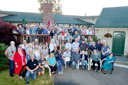 The Port Angeles High School Class of 1972 gathers in front of the Peninsula Golf Club clubhouse to celebrate its 50th reunion. About 100 plus spouses attended Friday and Saturday at the golf course and Vern Burton gym. The class had 369 graduates, and event emcee Bob Wheeler made a toast to the 51 who have died since they graduated. Organizers were Diane Holth, Gail Ralston and Marcia Logan. (Dave Logan/for Peninsula Daily News)