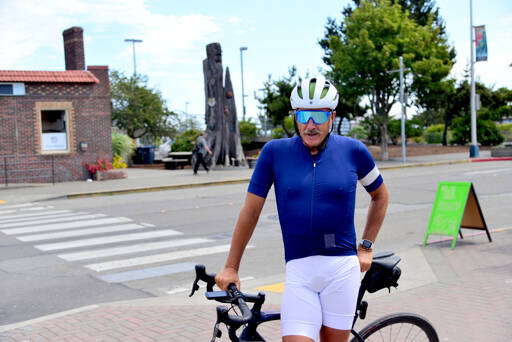 Cyclist Pete Lietz stops in Port Angeles on Monday as he neared the end of his more than 6,000-mile bike ride across the continental U.S. Lietz said the COVID-19 pandemic motivated him to follow through on something he’d only thought about, and he’s using the opportunity to raise money for men’s health. (Peter Segall / Peninsula Daily News)