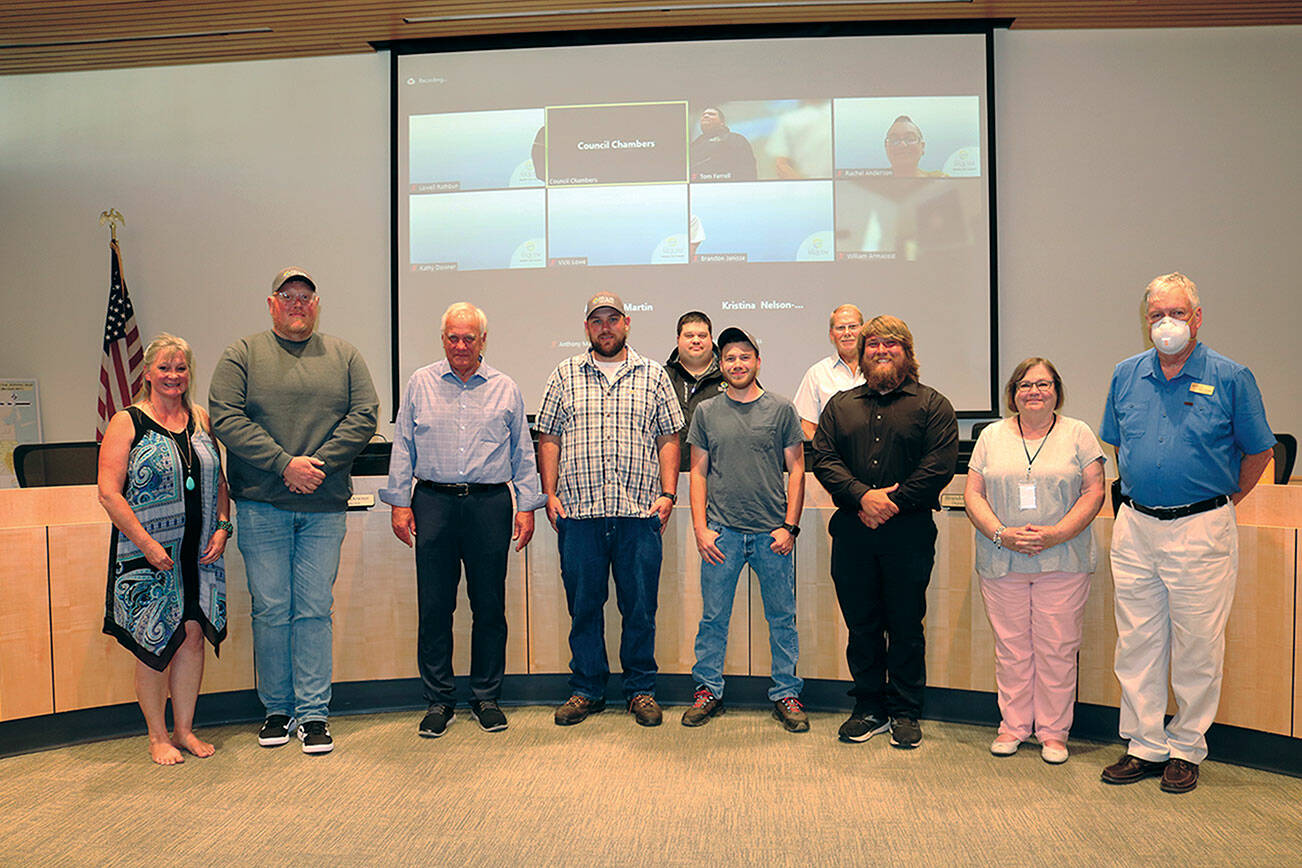 Pictured, in the front row, left to right, are Vicki Lowe, John Christenson, Mayor Tom Ferrell, Robert Whalen, Timmy Wright, Michael Latimer, Kathy Downer, Lowell Rathbun. The back row, on left is Brandon Janisse and, on the right, William Armacost.