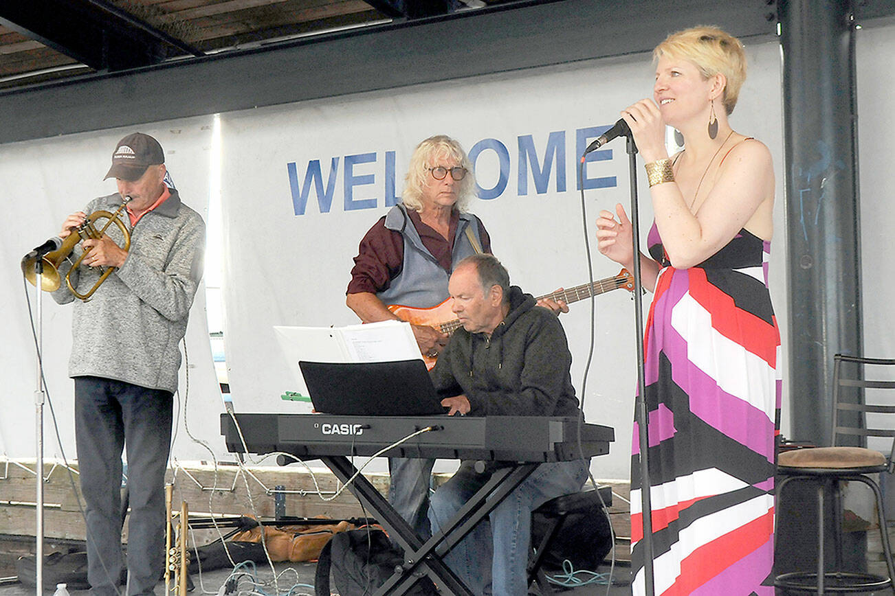 Keith Thorpe/Peninsula Daily News
Sarah Shea, right, and members of her band, Chez Jazz, from left, Ed Donohue, Joe D'Enrone and Al Harris, perform at Wednesday's Concert on the Pier music series at Port Angeles City Pier. The weekly free music series, presented by the Juan de Fuca Foundation for the Arts and sponsored by Erika Ralston Word/Windermere Real Estate, D.A. Davidson, the Elwha River Casino and the Peninsula Daily News, continues next Wednesday with the Bread and Gravy Quartet.