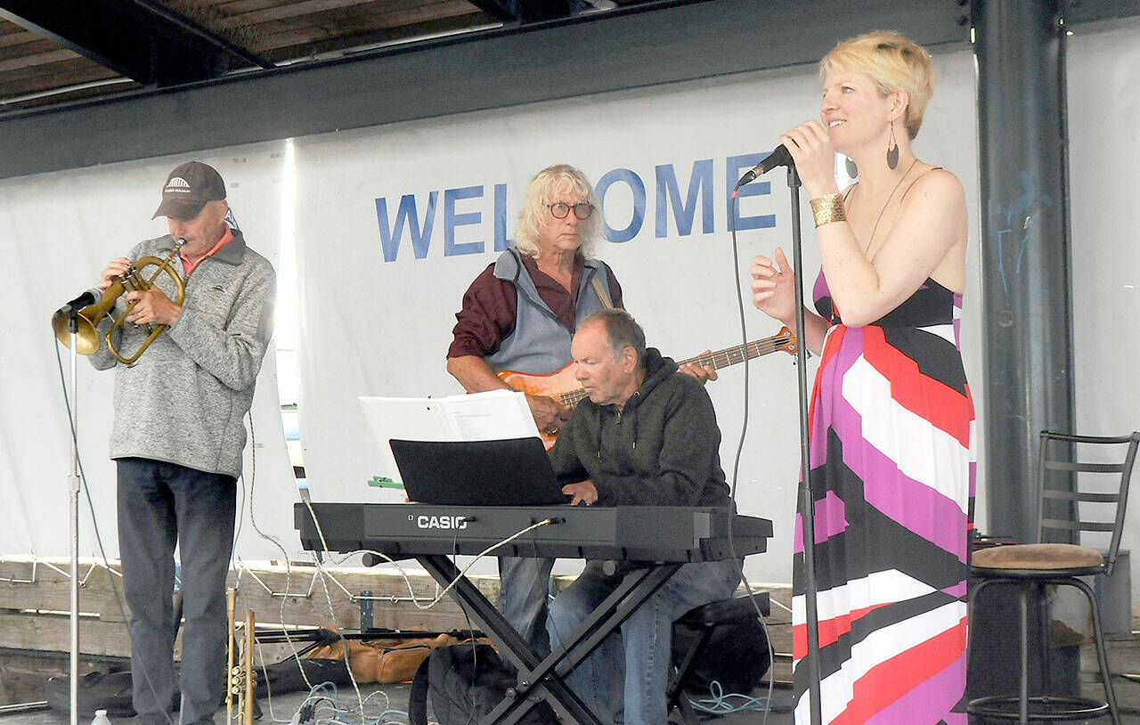 Sarah Shea, right, and members of her band, Chez Jazz, from left, Ed Donohue, Joe D’Enrone and Al Harris, perform at Wednesday’s Concert on the Pier music series at Port Angeles City Pier. The weekly free music series, presented by the Juan de Fuca Foundation for the Arts and sponsored by Erika Ralston Word/Windermere Real Estate, D.A. Davidson, the Elwha River Casino and the Peninsula Daily News, continues next Wednesday with the Bread and Gravy Quartet. (Keith Thorpe/Peninsula Daily News)