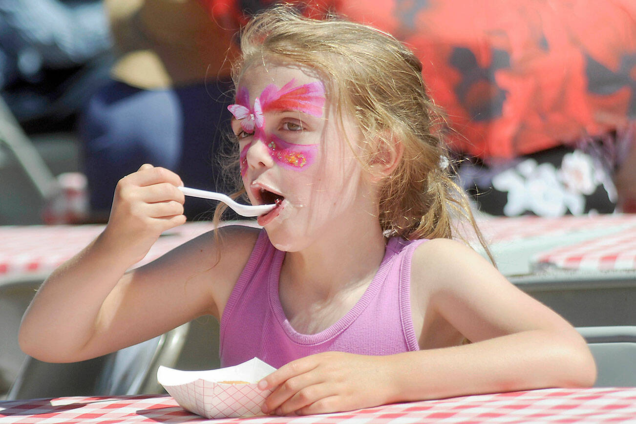 Gloria Fitzpatrick, 6, of Port Angeles enjoys a slice of blackberry pie a la mode during Saturday’s Joyce Daze celebration. (Keith Thorpe/Peninsula Daily News)