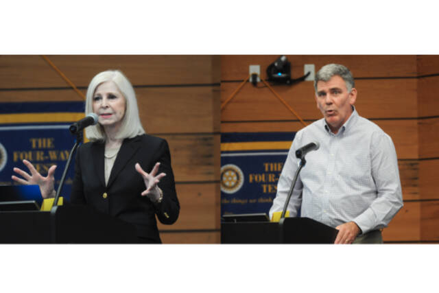 Michael Dashiell /Olympic Peninsula News Group

Cherie Kidd and Bruce Emery (seated), candidates for Clallam County Director of Community Development, speak at a debate hosted by the Rotary Club of Sequim at the Dungeness River Center.