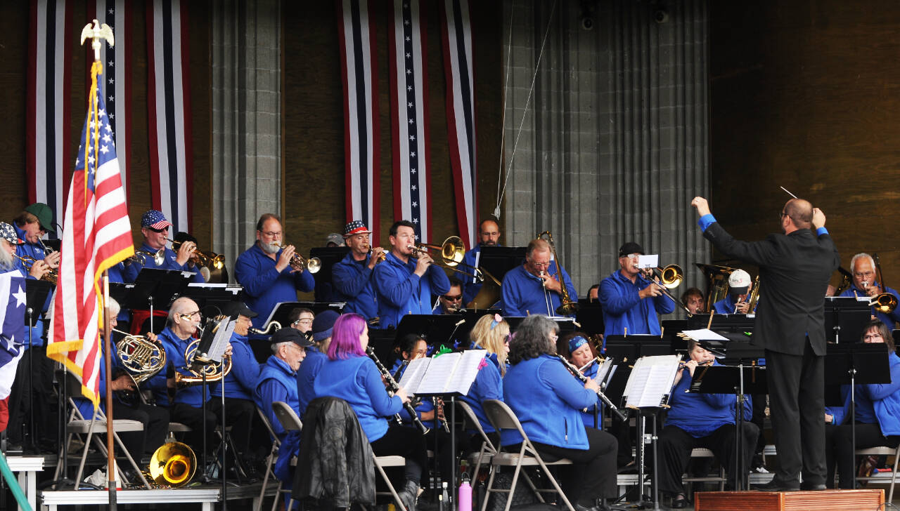 Under the direction of Tyler Benedict, the Sequim City Band entertains the Independence Day Celebration crowd at the James Center for Performing Arts on the Fourth of July. The band offers “Movies, Musicals, and Marches” at its free concert on Sunday. (Michael Dashiell /Olympic Peninsula News Group)