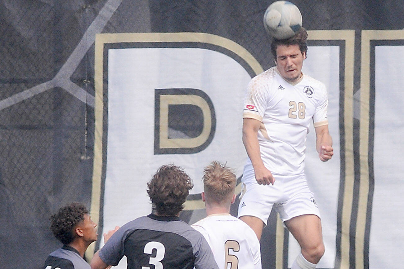Keith Thorpe/Peninsula Daily News
Peninsula's Kai Biegler takes the header above Wenatchee Valley's Diego Zaldivar, left, and Pierce Naccarato and Peninsula teammate Tim Deser on Thursday at Wally Sigmar Field.