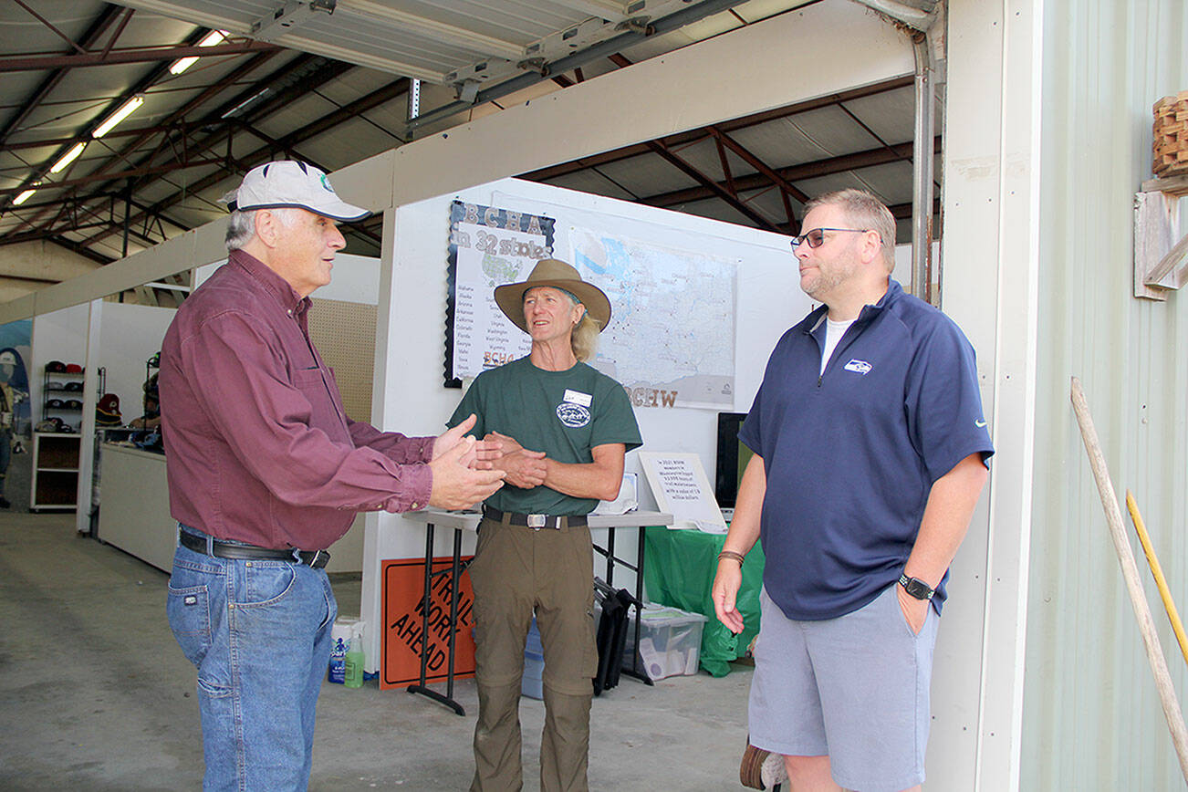 Photo by Karen Griffiths

 

Cutline: BCH Buckhorn Range member, and Jefferson County Assessor Jeff Chapman, left, with fellow member Bob Hoyle and State Representative Mike Chapman discuss some of the problems and possible solutions to keeping dedicated multi-use trails open to horses, along with preserving the ruralness of Miller Peninsula State Park for “our kids and future generations,” emphasized M. Chapman.