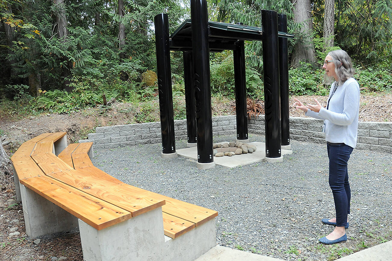 Sadie Crowe, steward for Peninsula College’ House of Learning, talks on Friday about a “learning circle” for outdoor instruction behind the Longhouse on the Port Angeles campus. (Keith Thorpe/Peninsula Daily News)