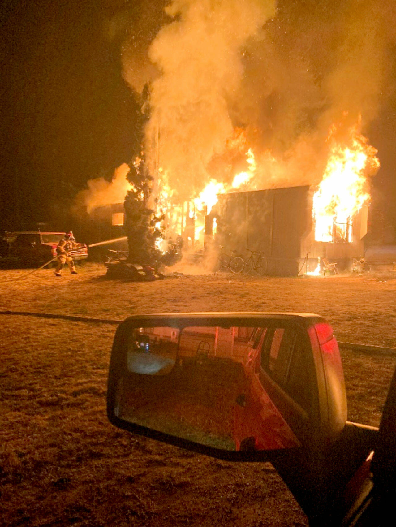 East Jefferson Fire Rescue firefighters battle a structure fire in Port Hadlock early Thursday morning. (East Jefferson Fire Rescue)