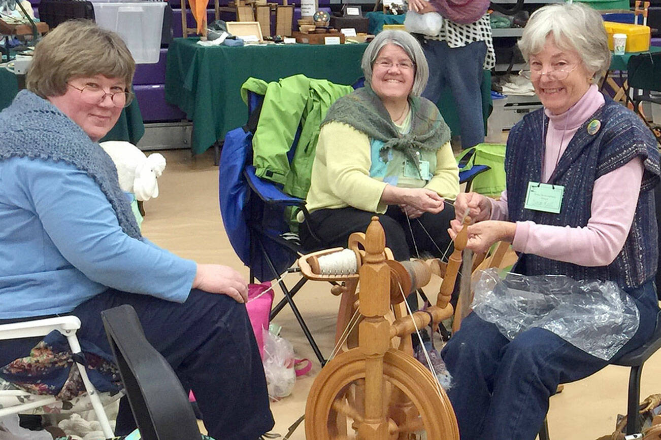 From left are  Beth Witters, MarySue French and Susan Kroll at a spinning circle.