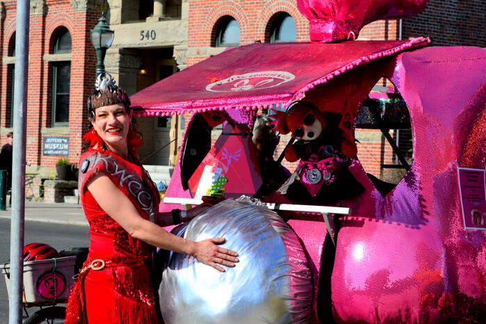 RoseHips Kween Pheanamix, also known as Anami of Port Townsend, cozies up to the Goddess Bunny sculpture just before the start of the Great Port Townsend Bay Kinetic Skulpture Race on Sunday morning. The race got underway at noon on Water Street, then ran uphill on Monroe and Lawrence streets, heading for the beach at Fort Worden State Park, and then the “Dismal Bog” at the Jefferson County Fairgrounds. (Diane Urbani de la Paz/For Peninsula Daily News)