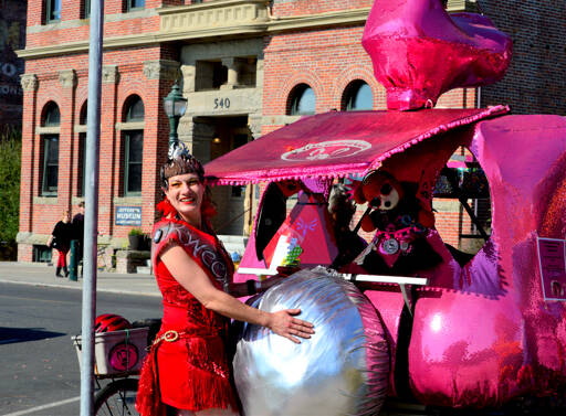 RoseHips Kween Pheanamix, also known as Anami of Port Townsend, cozies up to the Goddess Bunny sculpture just before the start of the Great Port Townsend Bay Kinetic Skulpture Race on Sunday morning. The race got underway at noon on Water Street, then ran uphill on Monroe and Lawrence streets, heading for the beach at Fort Worden State Park, and then the “Dismal Bog” at the Jefferson County Fairgrounds. (Diane Urbani de la Paz/For Peninsula Daily News)