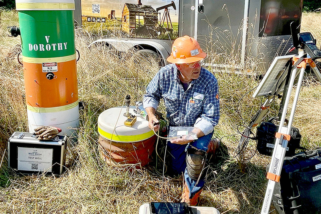 Curtis Shuck, chairman of the Well Done Foundation, a non-profit organization that works to cap abandoned oil and gas wells, conducts testing on a well in West Jefferson County. The well, located near the Hoh River in an area known as Oil City, is leaking emissions, and Shuck’s foundation is working to properly seal it. (Well Done Foundation)