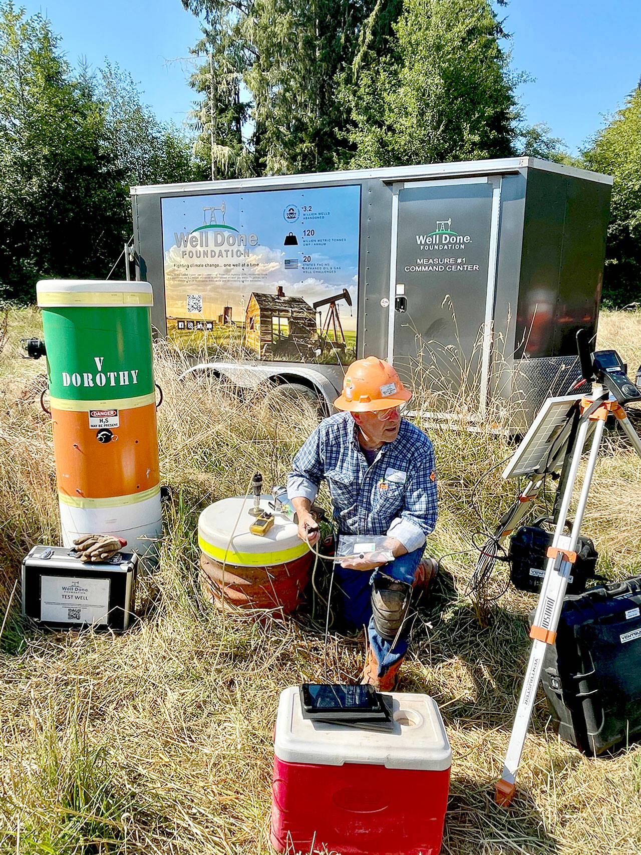 Curtis Shuck, chairman of the Well Done Foundation, a non-profit organization that works to cap abandoned oil and gas wells, conducts testing on a well in West Jefferson County. The well, located near the Hoh River in an area known as Oil City, is leaking emissions, and Shuck’s foundation is working to properly seal it. (Well Done Foundation)