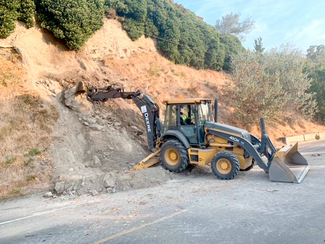 Port Townsend city crews remove landslide debris from Washington Street on Friday morning. (City of Port Townsend)