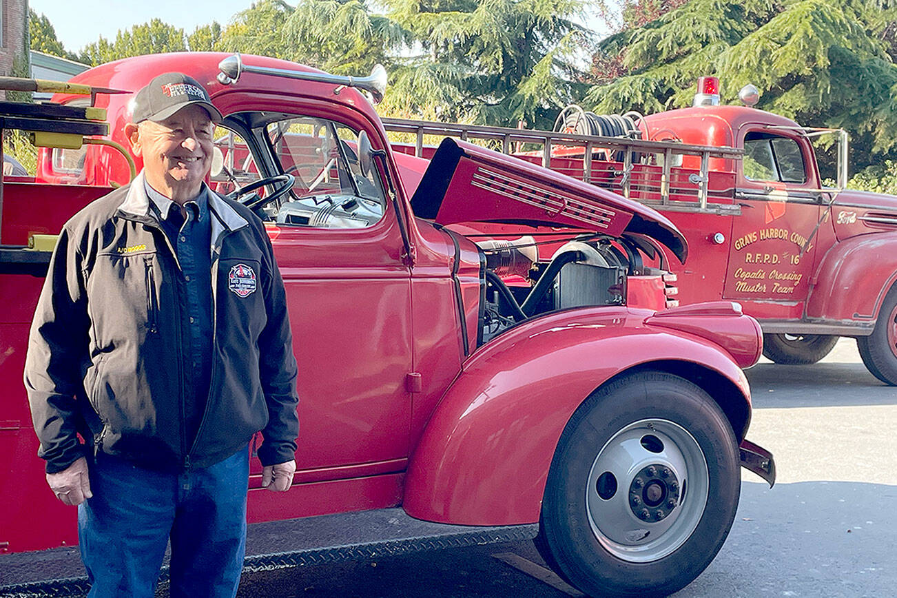 Chuck Boggs began his career as a firefighter in 1971 and retired as assistant chief of East Jefferson Fire and Rescue in 2010. Boggs attended the 150th anniversary celebration of the department Saturday at Port Townsend City Hall where vintage fire engines were on display. (Paula Hunt/Peninsula Daily News)