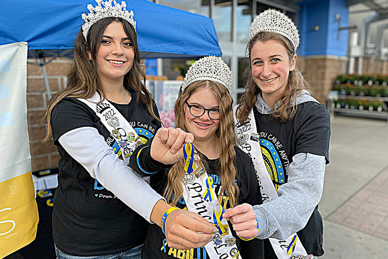 Matthew Nash/Olympic Peninsula News Group

Sequim Irrigation Festival royalty, from left, Queen Isabella Williams, Princess Lauren Willis, and Princess Katherine Gould helped promote Down Syndrome Awareness Month in front of Sequim Walmart.