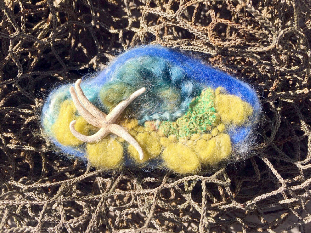 Jewelry by Pamela Raine.