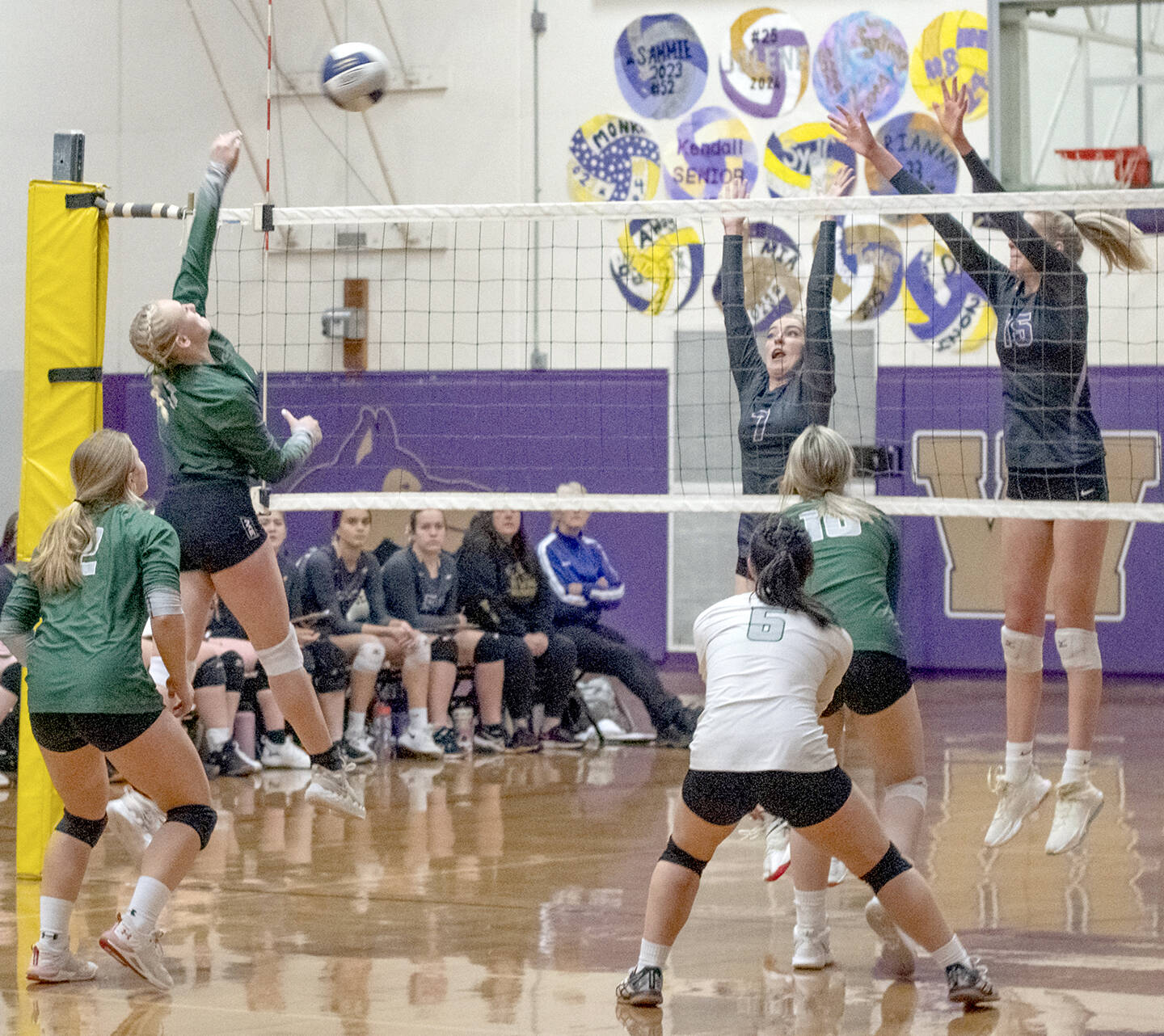 Emily Matthiessen/Olympic Peninsula News Group
#1 Port Angeles' Alaina Baublitz, left, looks to hit past the block of Sequim's Sydney Clark, center, and Kendall Hastings in an Olympic League tournament game on Nov. 3 in Sequim. The host Wolves topped PA's Roughriders in three games.