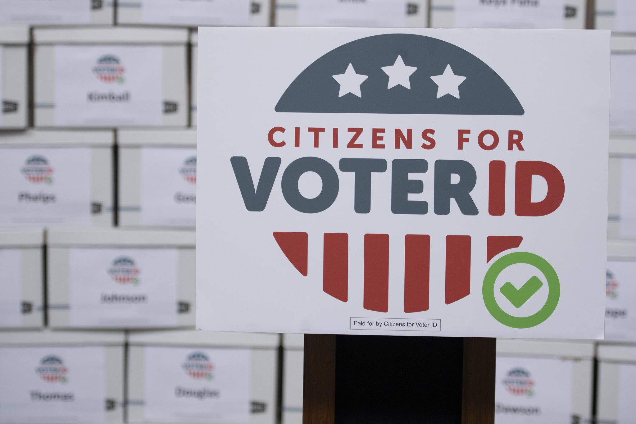 Boxes of signatures are displayed after a news conference hosted by Citizens for Voter ID at the Nebraska Capitol building on July 7, 2022, in Lincoln, Neb. Voters in several states are deciding measures that could affect the way they cast ballots in future elections. While some measures would expand access to voting, proposals elsewhere would impose new identification requirements to cast ballots or raise the threshold to pass citizen initiatives. (Noah Riffe/Lincoln Journal Star via The Associated Press)