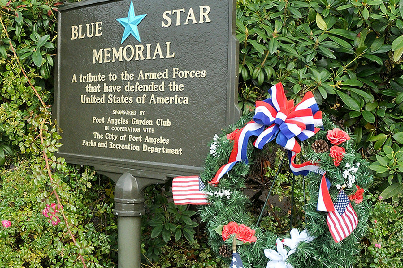KEITH THORPE/PENINSULA DAILY NEWS
A wreath stands next to the Blue Star Memorial armed forces tribute marker on Thursday at Veteran's Park in Port Angeles.