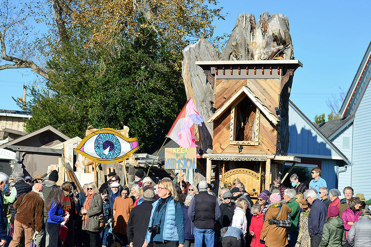 About 75 people gathered in support of Kevin Mason’s “Raccoon Lodge” at noon Saturday. The Port Townsend carpenter and artist built the structure on Clay Street with a huge tree stump as its foundation. (Diane Urbani de la Paz/for Peninsula Daily News)