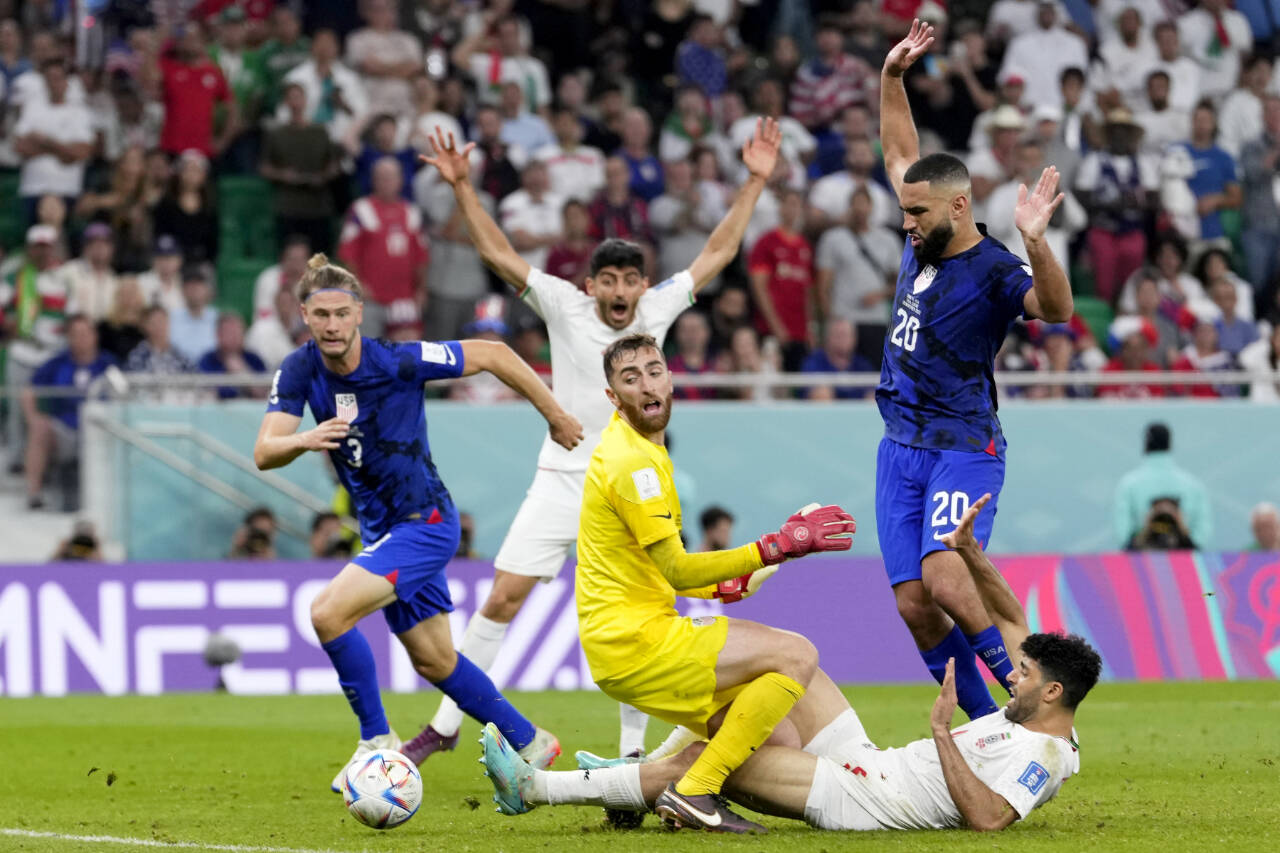 Goalkeeper Matt Turner of the United States makes aa save during the World Cup group B soccer match between Iran and the United States at the Al Thumama Stadium in Doha, Qatar on Wednesday. (AP Photo/Manu Fernandez)