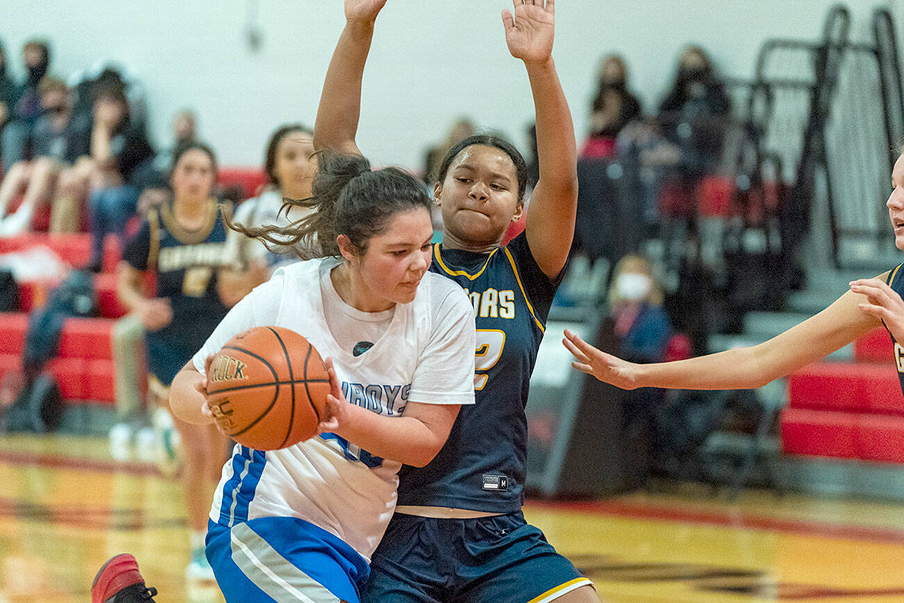 Steve Mullensky/for Peninsula Daily News
East Jefferson's Alyssa Vandenberg drives to the rim while defended by Annie Wright’s Leah Kearns during a December 2021 game played at Port Townsend High School. Vandenberg, a second-team All-Nisqually League selection last season, returns for the Rivals.