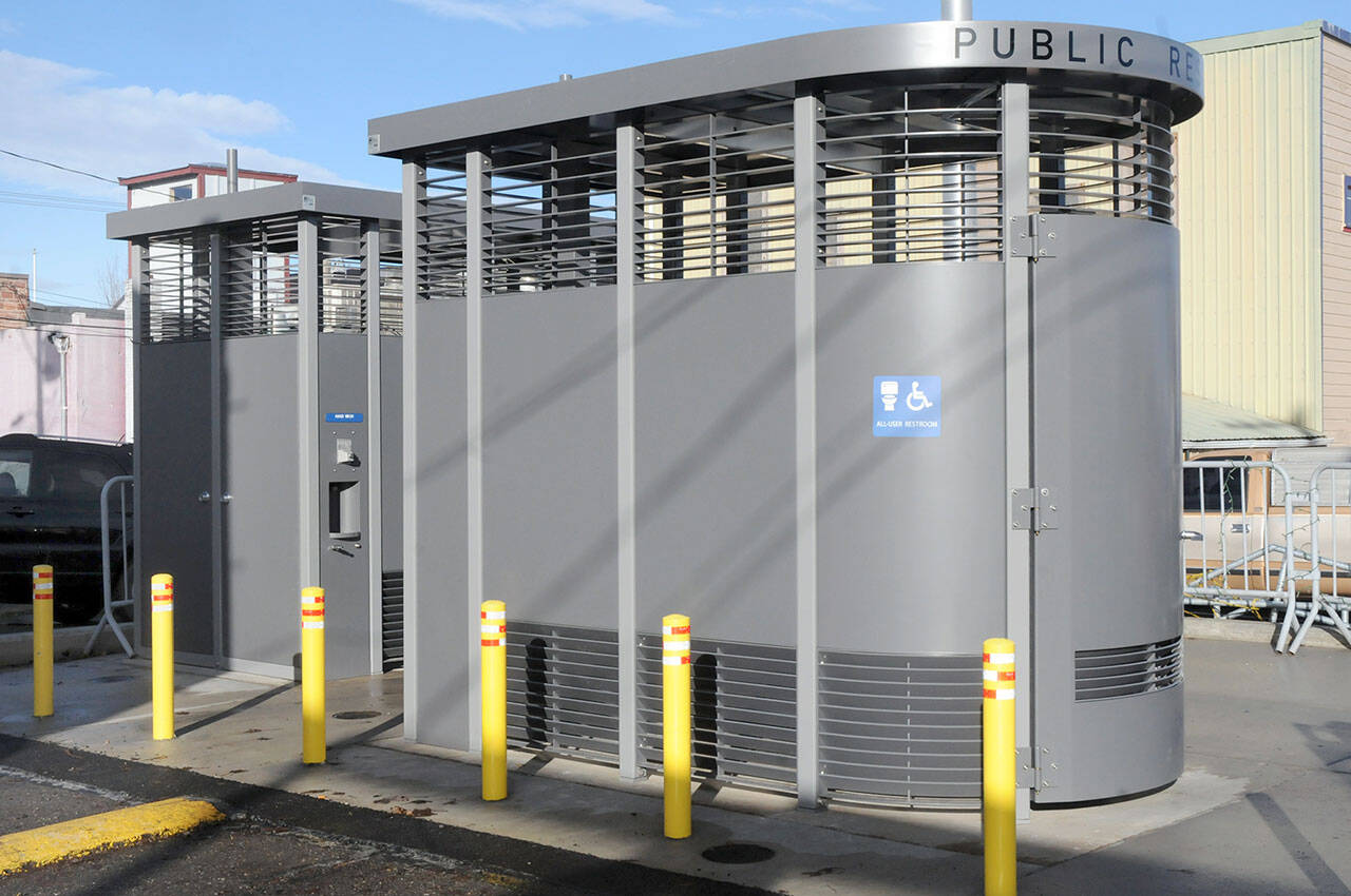 A pair of Portland Loo public restroom stalls wait on Saturday for their official opening, scheduled for today, at the breezeway parking lot in downtown Port Angeles. (Keith Thorpe/Peninsula Daily News)