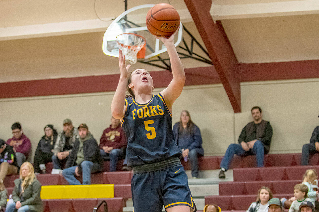 Eric Trent/Daily Chronicle
Forks' Keira Johnson skies for a layup during the Spartans' 74-25 win over South Bend on the road Friday night.