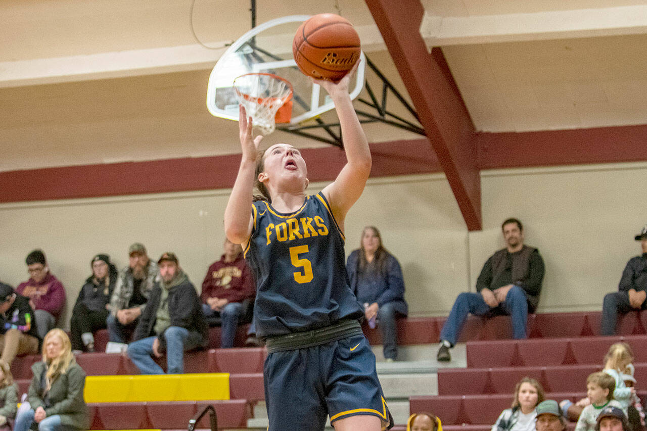 Forks’ Keira Johnson skies for a layup during the Spartans’ 74-25 win over South Bend on the road Friday night. (Eric Trent/Daily Chronicle)