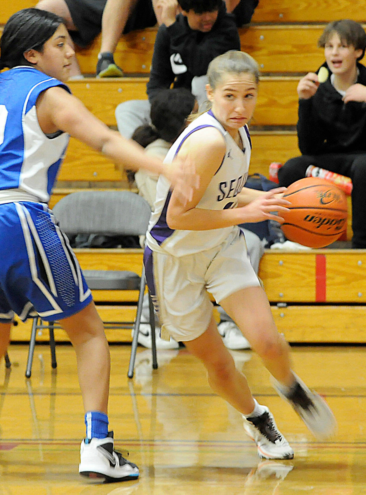 Matthew Nash/Olympic Peninsula News Group Sequim’s Tary Johnson, right, looks to get past North Mason’s Felicity Fowler in a 53-27 home win over North Mason on Dec. 15. Johnson had four points, three rebounds and two assists against the Bulldogs.