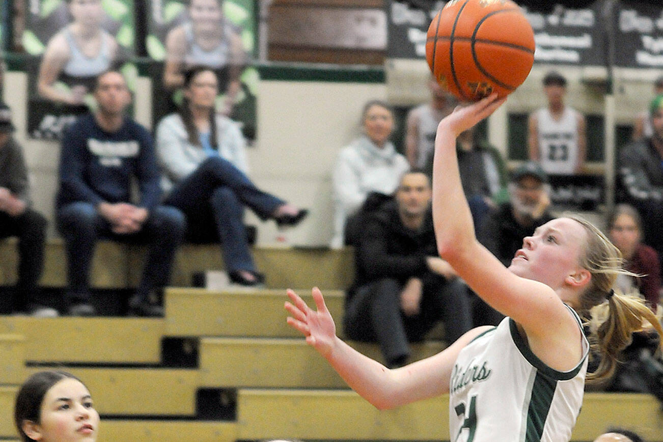 KEITH THORPE/PENINSULA DAILY NEWS
Port Angeles' Anna Petty, front, goes for the quick layup as North Kitsap defenders, from left, Megan Komar, Teegan DeVries and Coriana McMillian look on during Tuesday's game at Port Angeles High School.