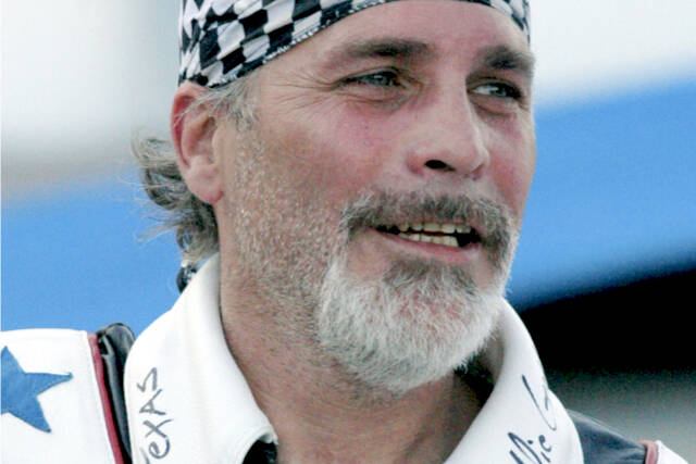 FILE - Robbie Knievel appears after his motorcycle jump before the start of the IRL Firestone 550 auto race at the Texas Motor Speedway in Fort Worth, Texas on June 5, 2010. Knievel, an American stunt performer, died early Friday at a hospice in Reno, Nev., with his daughters at his side, his brother Kelly Knievel said. He was 60. (AP Photo/Randy Holt, File)