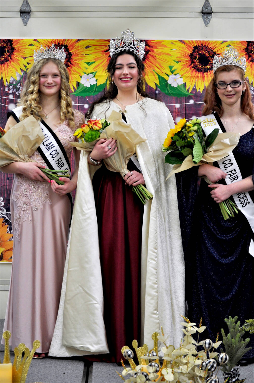 Pictured, from left to right, are Junior Princess Kendall Adolphe of Sequim, Queen Allison Pettit of Port Angeles and Princess Olivia Ostlund of Sequim. (Tara West/101 West Photography)