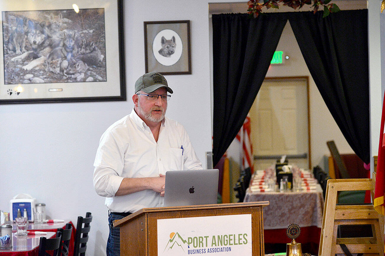 Matthew Rainwater, founder and president of Pennies for Quarters, a charity looking to build a tiny home village in Port Angeles for homeless veterans, told a meeting of the Nor'Wester Rotary Club of Port Angeles Friday the organization hopes to break ground later this year. (Peter Segall / Peninsula Daily News)