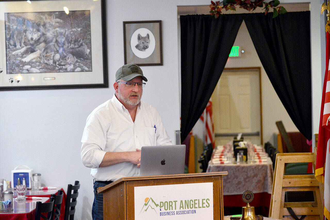 Matthew Rainwater, founder and president of Pennies for Quarters, a charity looking to build a tiny home village in Port Angeles for homeless veterans, told a meeting of the Nor’Wester Rotary Club of Port Angeles Friday the organization hopes to break ground later this year. (Peter Segall / Peninsula Daily News)
