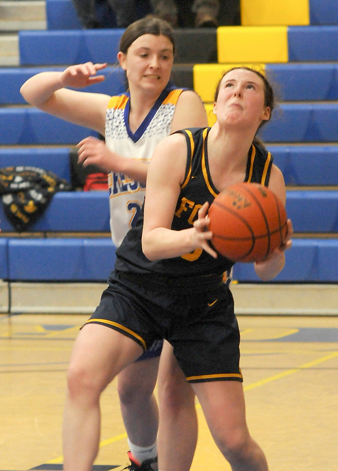 Forks’ Keira Johnson looks for the hoop as Crescent’s Kaylen Mason defends in Joyce in late December. Johnson made the Pacific 2B League first team. (Keith Thorpe/Peninsula Daily News)