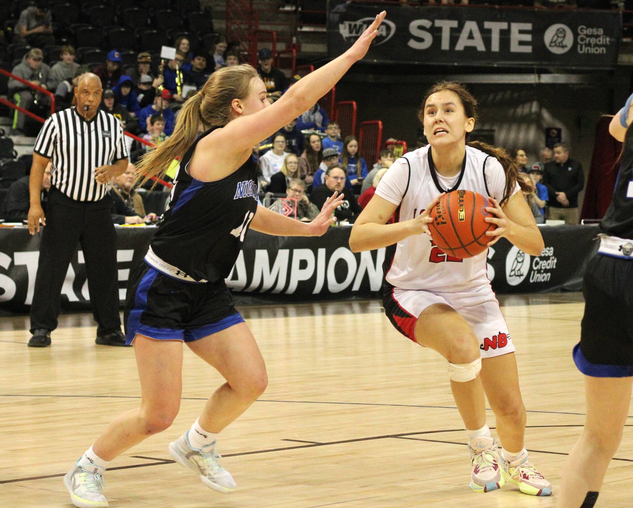 Neah Bay's Amber Swan drives against Oakesdale in the state 1B quarterfinals Thursday. Neah Bay beat Oakesdale, then beat Mount Vernon Christian in the semifinals Friday. Swan had seven points and nine rebounds in Friday's victory. The Red Devils will play for the state 1B championship Saturday. (Byrne Bennett/Cheney Free Press)