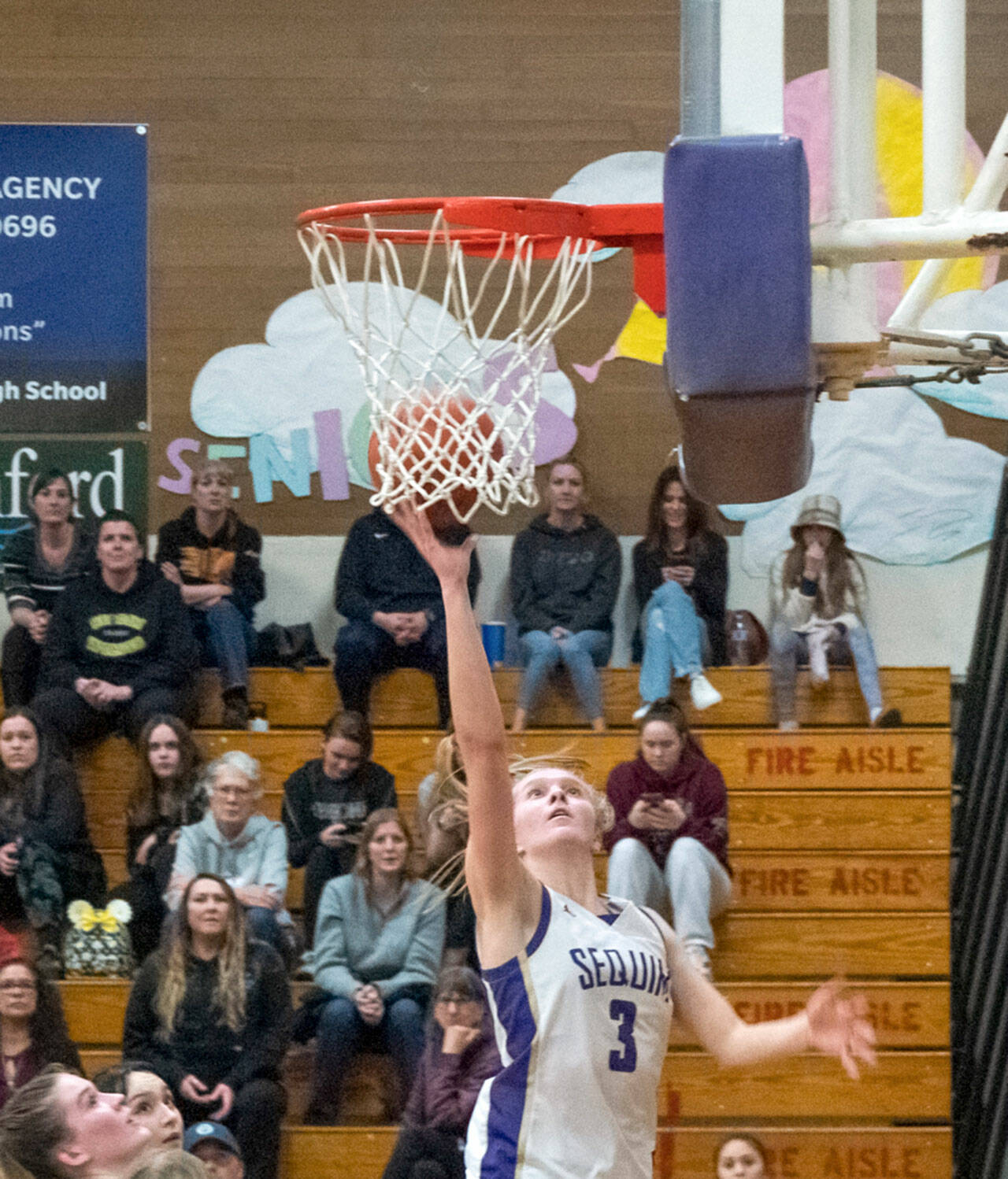 Sequim’s Jolene Vaara goes to the basket for two of her team-high 20 points in a 64-49 Olympic League win over North Kitsap. Vaara had six 20-point games and was named the Olympic League MVP and defensive player of the year. (Emily Matthiessen/Olympic Peninsula News Group)