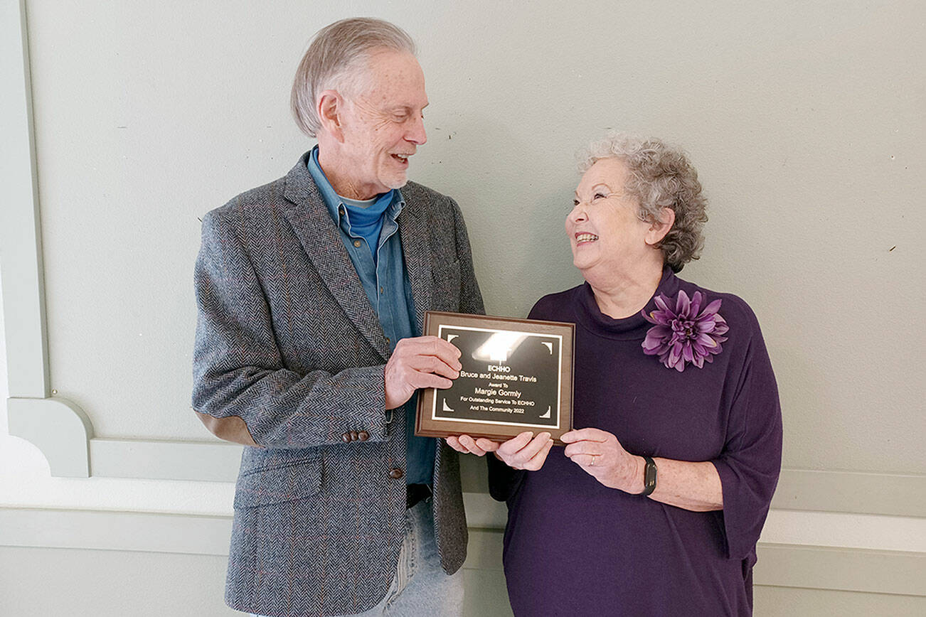Pictured is David Whitney, ECHHO board chair, presenting the award to Gormly.