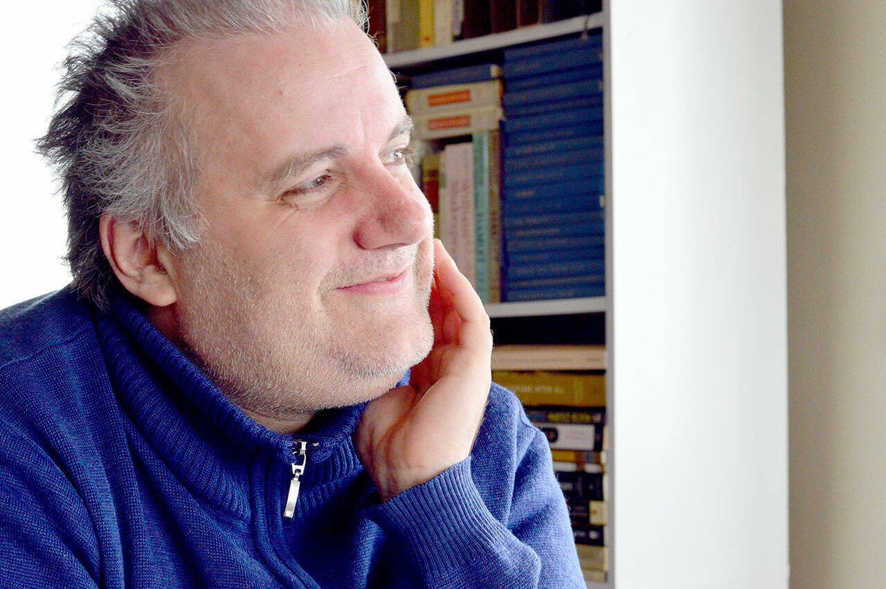 Spanish pianist Josu De Solaun fixes his gaze on the Dvorak concerto score he’ll perform with the Port Angeles Symphony this Saturday. (photo by Diane Urbani de la Paz)