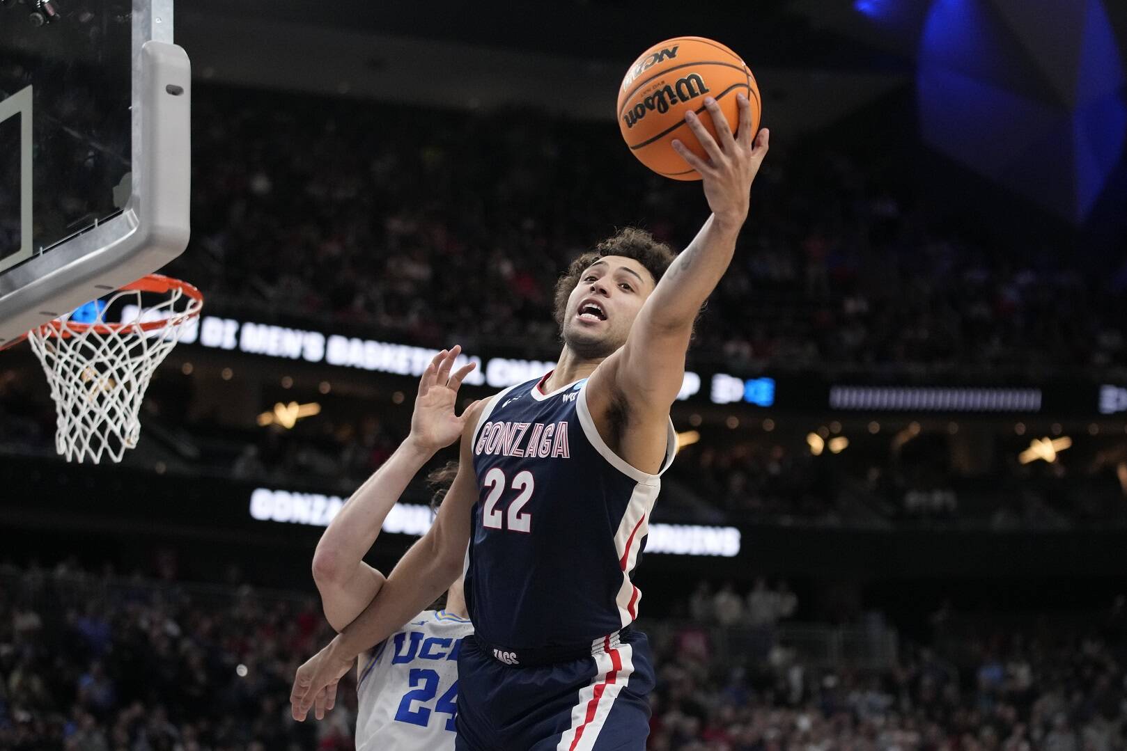 Gonzaga’s Anton Watson (22) reaches for the ball in the second half of a Sweet 16 college basketball game against UCLA in the West Regional of the NCAA Tournament, Thursday, March 23, 2023, in Las Vegas. (AP Photo/John Locher)