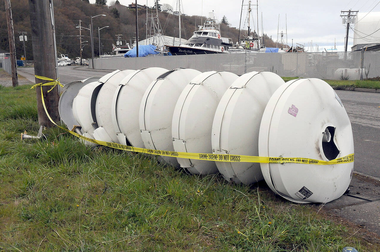 A tsunami alert siren lies crumpled at the bottom of its support mast on Marine Drive near Port Angeles Boat Haven on Friday morning. (KEITH THORPE/PENINSULA DAILY NEWS)