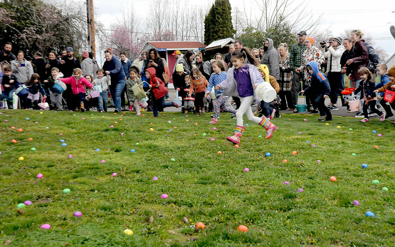 Children bolt from the starting line in search of treat-filled eggs during Saturday’s 45th annual KONP Easter Egg Hunt at the Clallam County Fairgrounds in Port Angeles. Hundreds of youngsters took part in the event. (Keith Thorpe/Peninsula Daily News)
