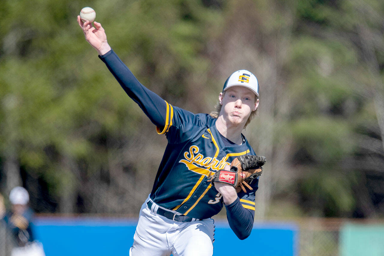 Forks’ Gunner Rogers delivers a pitch during game one of the Spartans’ doubleheader sweep of Raymond-South Bend on the road Wednesday. (Photo courtesy of Eric Trent)