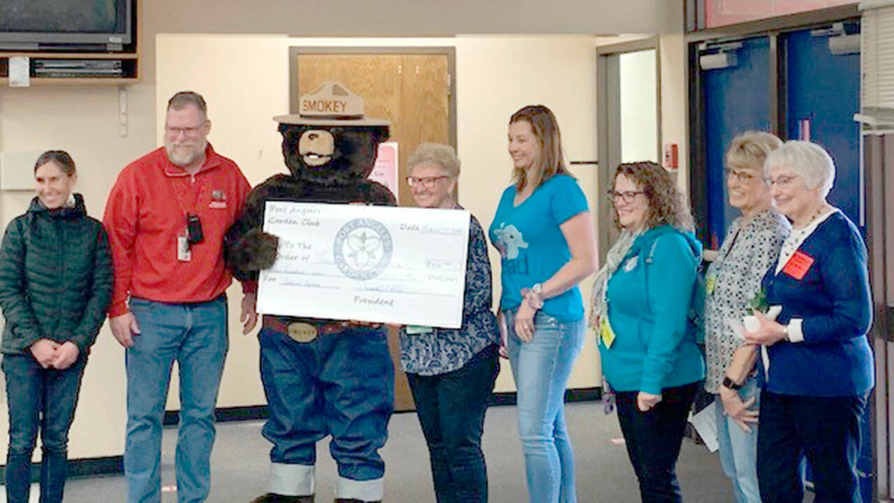Pictured, left to right, are Carmen Geyer, Jeff Lunt, Smokey T. Bear, Linda Skolnik, Sarah Schaefermeyer, Darlene Martin and Jane Marks.
