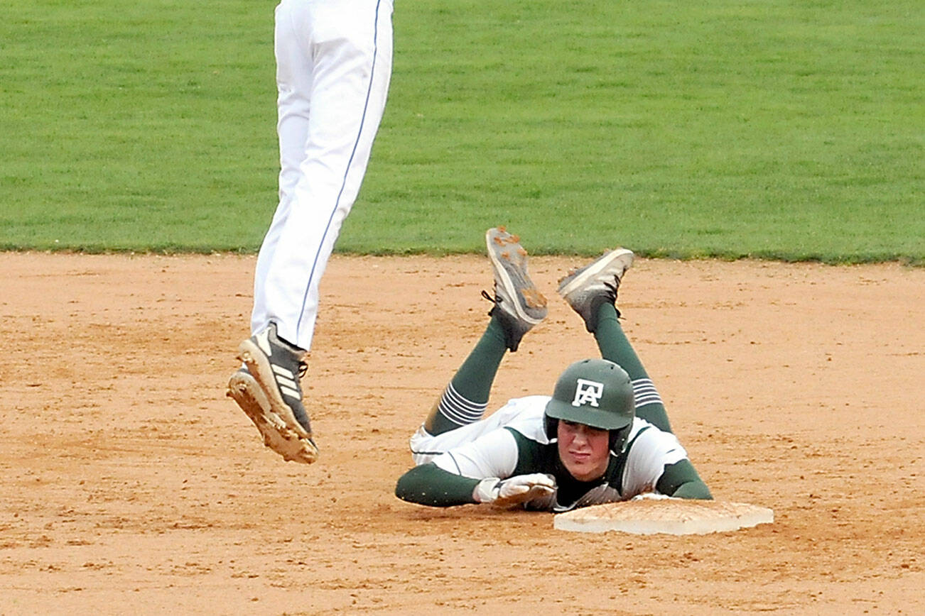 KEITH THORPE/PENINSULA DAILY NEWS
Port Angeles' Kole Acker, scrambles back to second after tripping while rounding the bag while North Mason shortstop Dylan Prideaux reaches for the throw from the outfield on Tuesday at Port Angeles Civic Field.