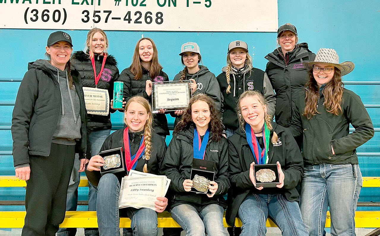 Sequim’s high school equestrian team celebrates taking home the district 4 small teams Championship, along with belt buckles and medals at the end of their final district WAHSET competition. The team’s high scores also earned them 24 qualifying placements to compete at the State Finals in May. Standing from left: Coach Katie Newton, Celbie Karjalainen, Katelynn Sharpe, Lily Meyer, Kennady Gilbertson, Coach Bettina Hoesel, Assistant Coach Keri Tucker. Sitting from left: Libby Swanberg, Sydney Hutton, Paige Reed. (Photo submitted by Katie Newton)