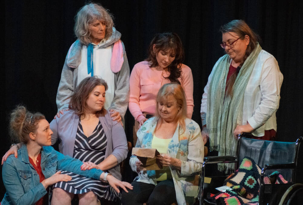Front, from left to right, Merrin Packer, Taryn Dupont, Cheryl DiPietro and, behind, Cheryl Tamblyn, Jamie Pauley and Amy Henry participate in a poignant scene in “Calendar Girls,” Olympic Theatre Arts’ newest production. (Emily Matthiessen/Olympic Peninsula News Group)