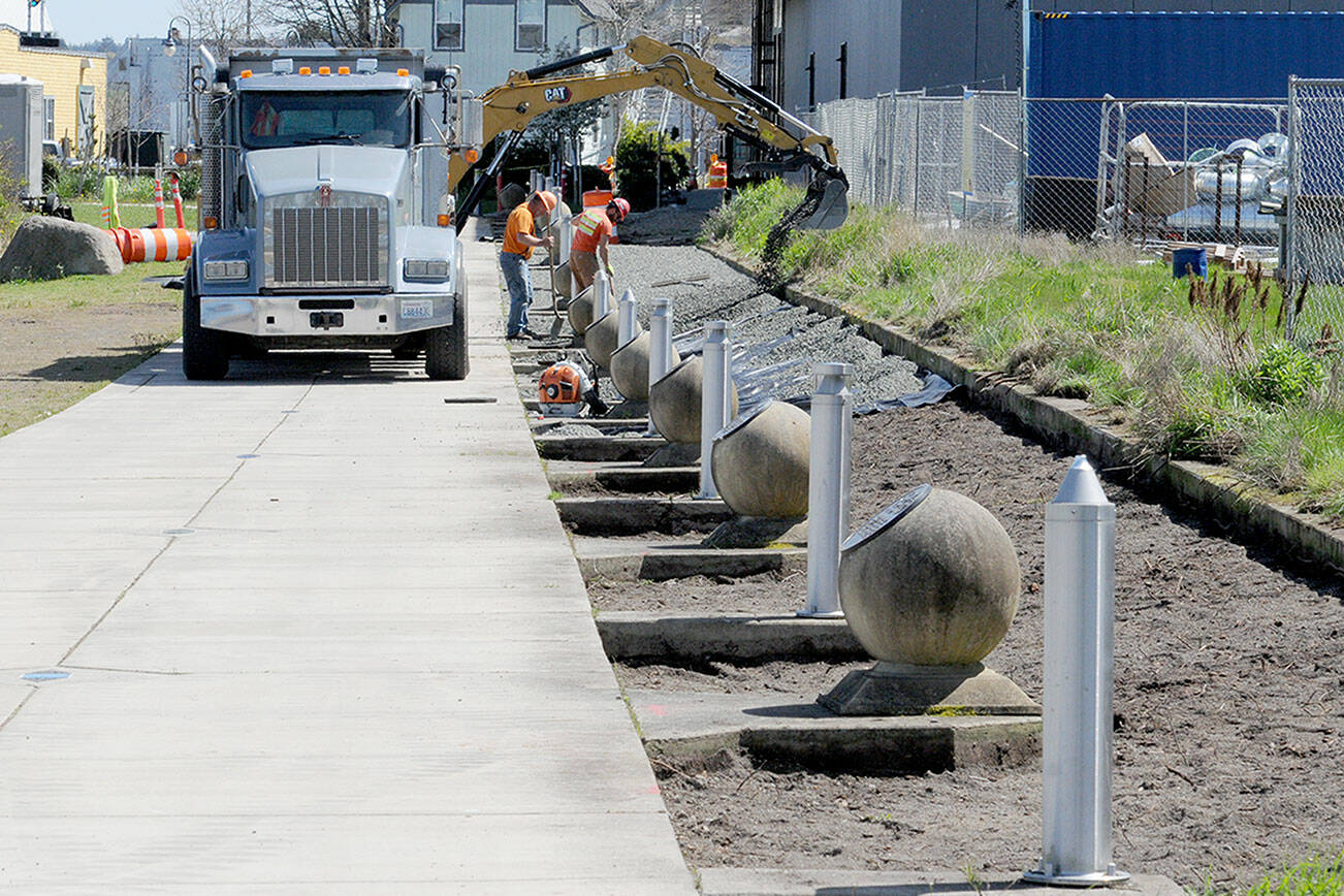 KEITH THORPE/PENINSULA DAILY NEWS
A construction crew performs landscape work along a portion of the Waterfront Trail, part of the Olympic Discovery Trail, at Pebble Beach Park on Friday near downtown Port Angeles. As part of the project, vegetation along the trail was removed for trail upkeep and beautification. The trail through the park was closed during the work, but was scheduled to be reopened by today.